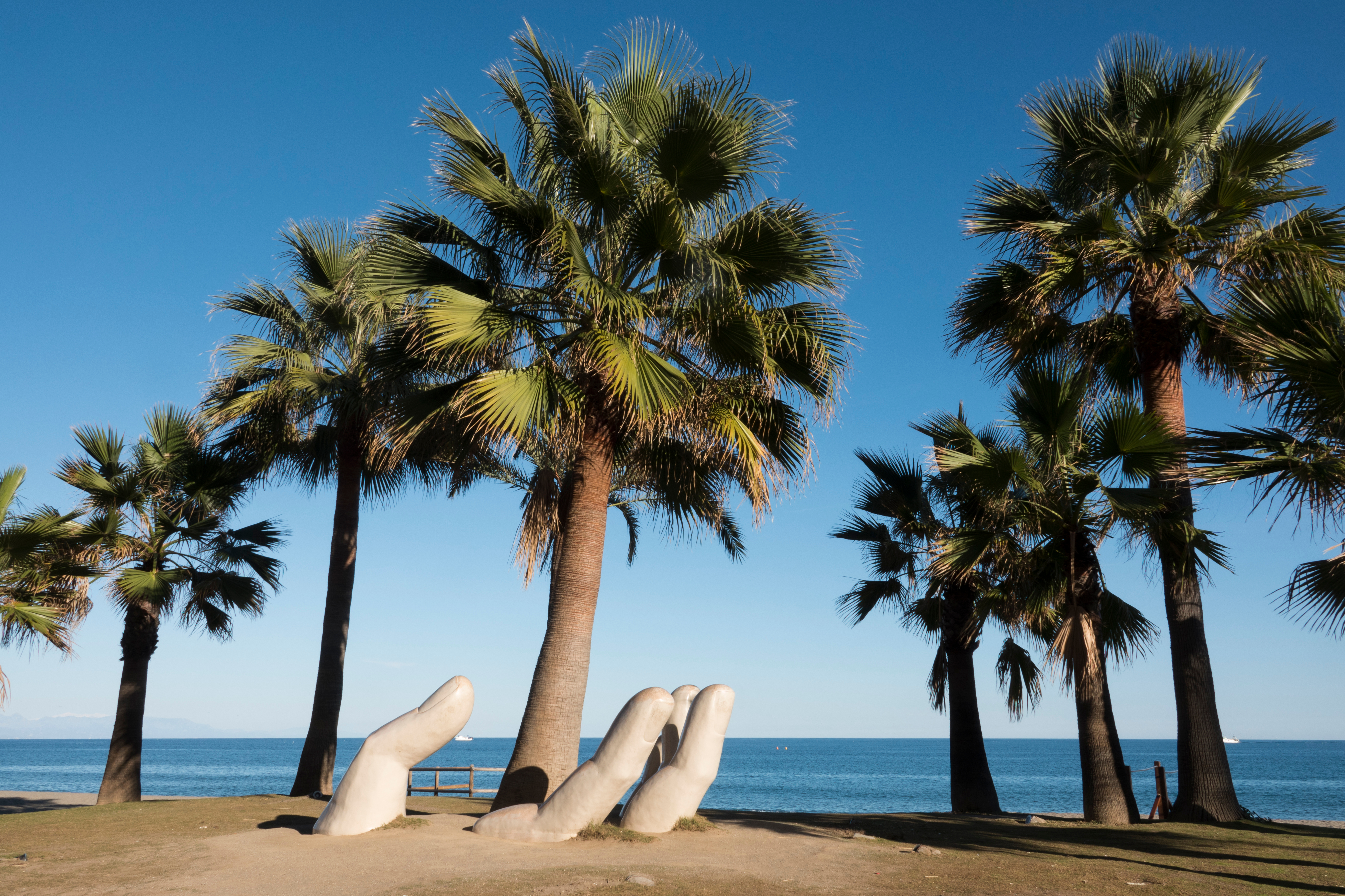 The Open Hand sculpture by Charo Garcia is just one of the many draws to the luscious beaches