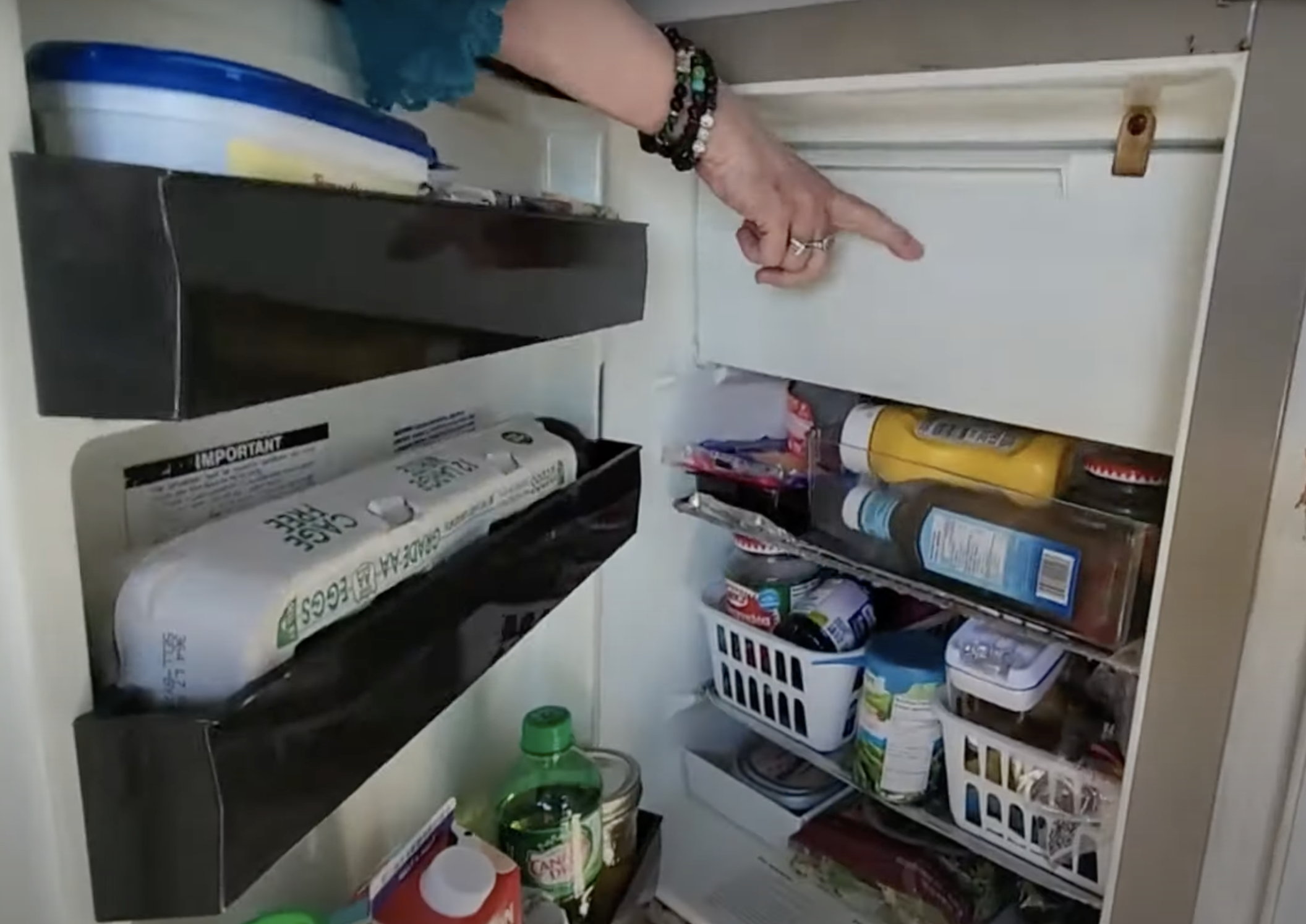 The kitchen has a fully functioning fridge with a small freezer