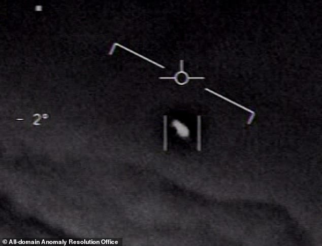 This UFO, also captured by the US Navy, can only be described as looking like a 'milk bottle' or a bowling pin