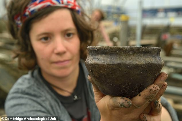 Ceramic and wooden containers, including tiny cups, bowls, and large storage jars, were found