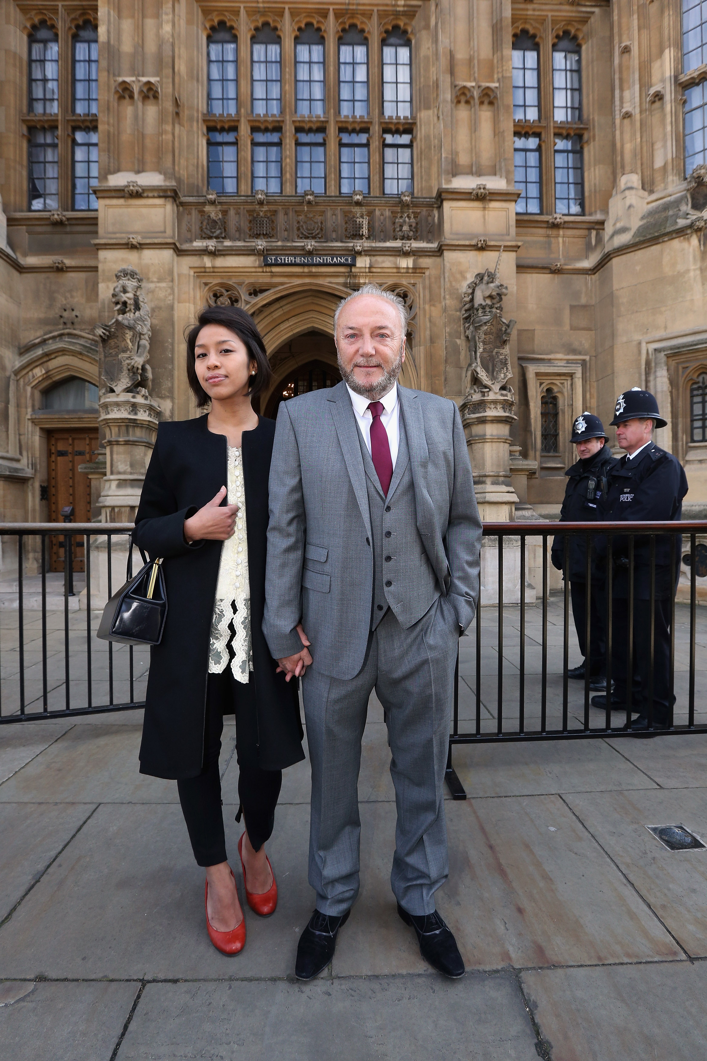 George Galloway posing for a photograph with his wife Putri Gayatri Pertiwi in front of the Houses of Parliament on April 16, 2012