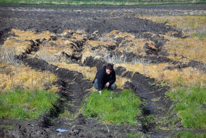 Luke Abblitt inspecting waterlogged fields