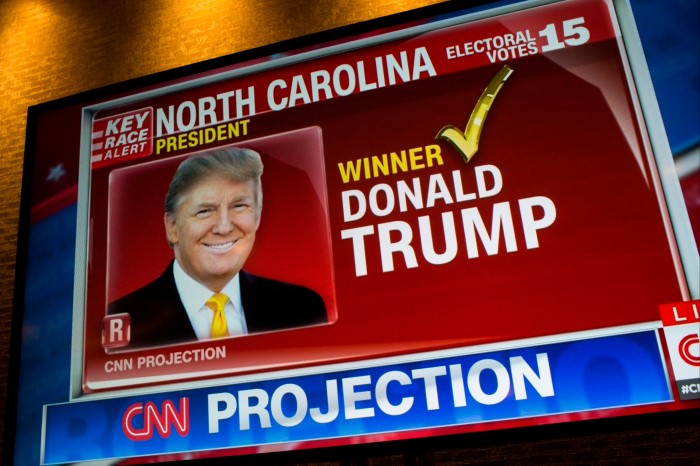 A picture of Donald J Trump appears on a CNN television program after the Republican party nominee won the vote from the state of North Carolina at the Hilton Hote on November 9, 2016