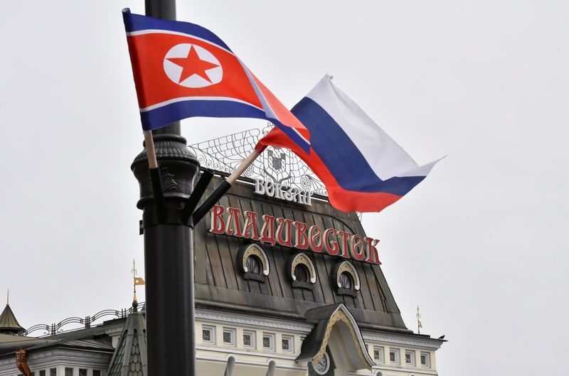 © Reuters. State flags of Russia and North Korea fly in a street near a railway station during the visit of North Korea's leader Kim Jong Un to Vladivostok, Russia April 25, 2019. REUTERS/Yuri Maltsev/File Photo