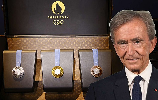 Influence: LVMH boss Bernard Arnault - the world's richest man - with the medals for the Olympic games
