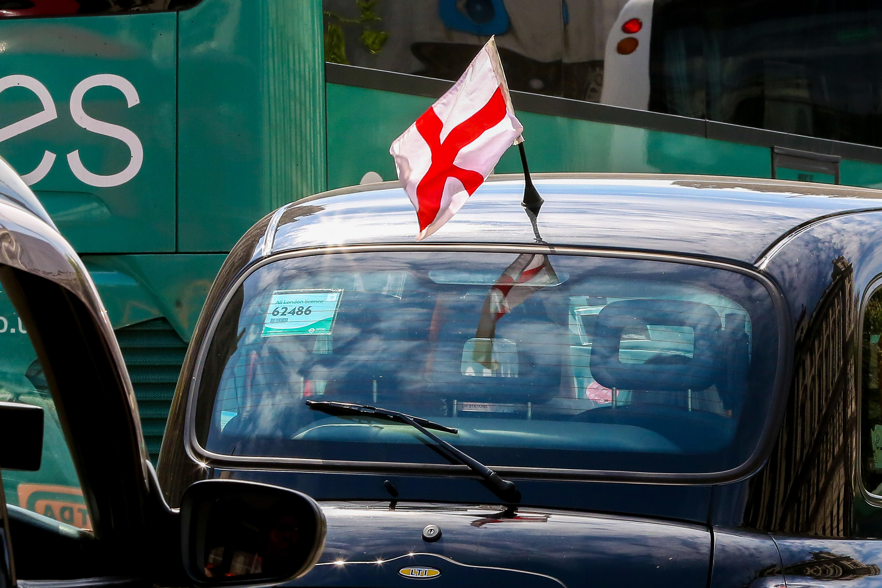 Cabbies have demanded that the 'bonkers' ban on flying flags be overturned for St George's Day