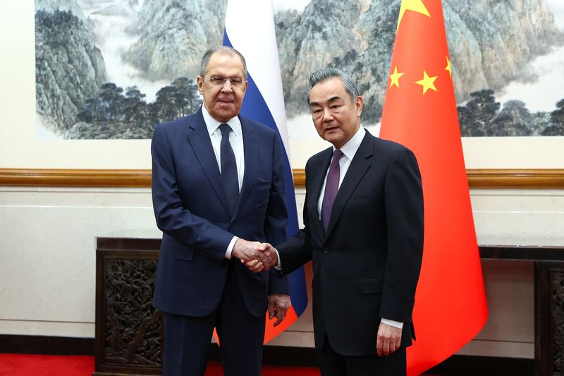 © Reuters. Russia's Foreign Minister Sergei Lavrov shakes hands with China's Foreign Minister Wang Yi during a meeting in Beijing, China April 9, 2024. Russian Foreign Ministry/Handout via REUTERS
